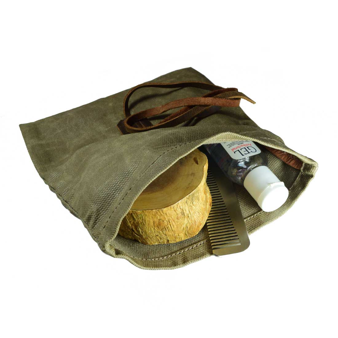 Hide & Drink's Rolling Pouch, a rugged Survival Roll Top Pouch made from Waxed Canvas & Full Grain Leather. Perfect as a Multipurpose Bag and lightweight case for outdoor adventures, this artisan piece is handmade in La Antigua Guatemala & Oaxaca, Mexico.