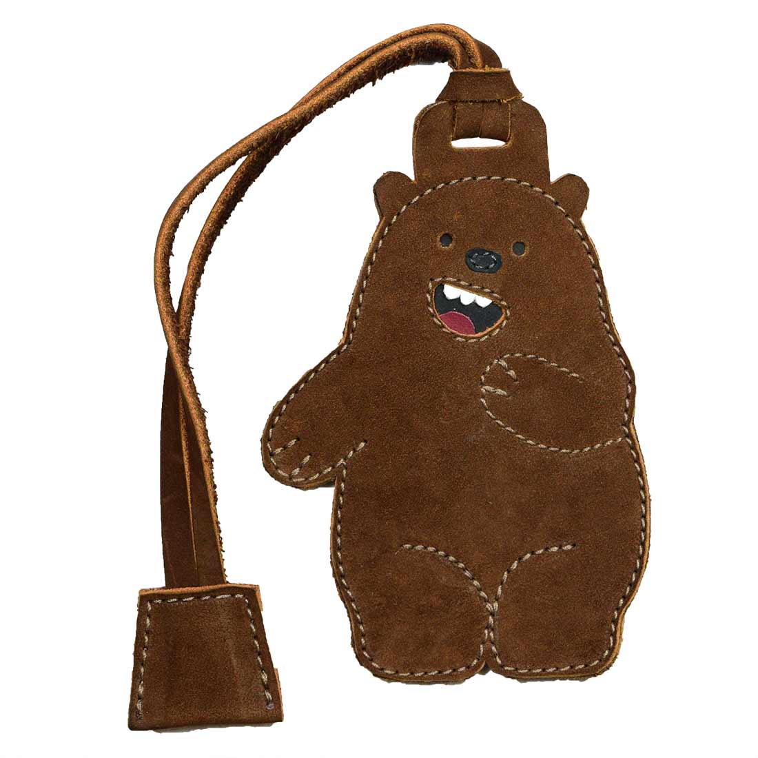 Cute Bear Luggage Tag from Hide & Drink, showcasing its friendly design. Ideal as a suitcase identifier and baggage label, this travel essential is made from full grain leather. Experience small batch production with this hand cut and hand sewn artisan product, fire branded and handmade in La Antigua Guatemala & Oaxaca Mexico.