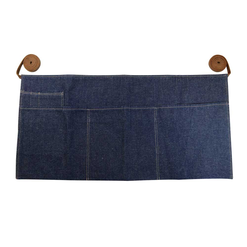 Hide & Drink's Repurposed Denim Waist Apron showcasing its vibrant color and heavy-weight material, crafted with Full Grain Leather, perfect for the kitchen or workshop. This unique waist apron is handmade in La Antigua Guatemala & Oaxaca Mexico, reflecting artisan skills with small batch production, hand cut, hand sewn, and fire branded details.