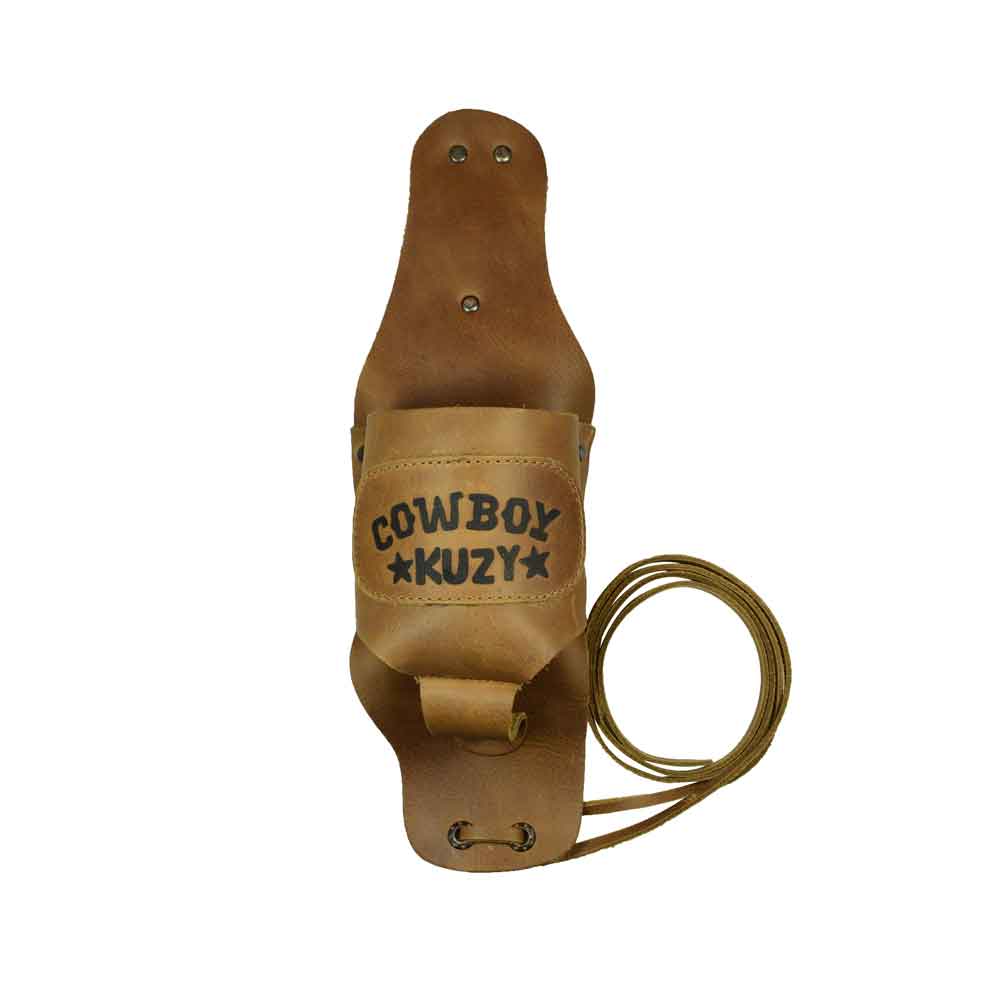 Hide & Drink Beer Holster Cowboy Buzy, a Beer Holster for Cowboy that fits snugly on your belt for hands-free convenience. This Western Bottle Leg Grip is made from full grain leather, showcasing the quality of small batch production and artisan techniques from La Antigua Guatemala.