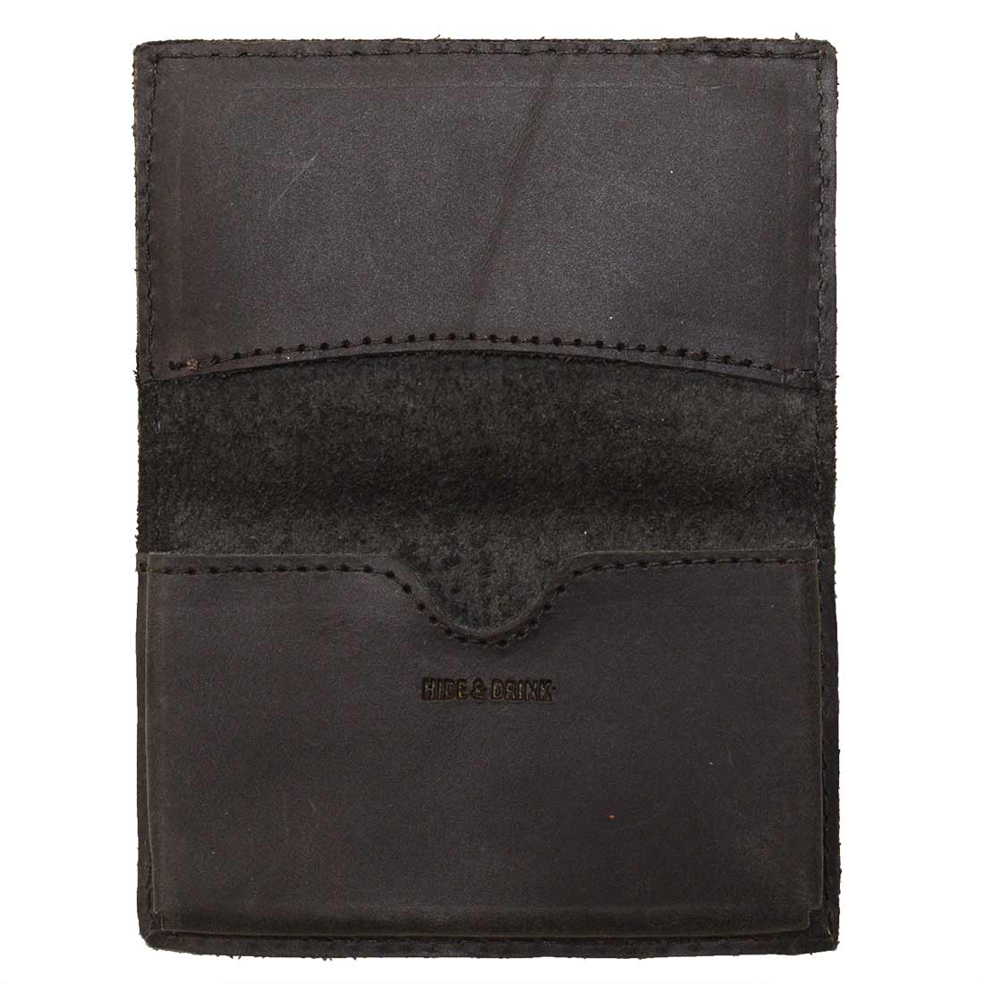 Front view of Hide & Drink's Vintage Card Holder in black leather, displaying its rustic charm. This vintage business card holder is perfect as a cash organizer and wallet, hand cut and sewn in small batches by artisans from La Antigua Guatemala & Oaxaca Mexico.