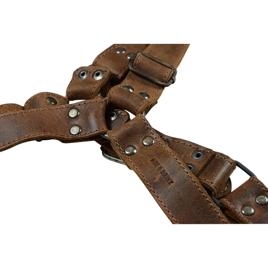 Instructions for measuring a dog's size for the No Pull Dog Harness by Hide & Drink, which ensures a perfect fit with adjustable straps. This No Pull Walking Dog Harness is crafted from full grain leather, representing artisan quality and care from La Antigua Guatemala & Oaxaca Mexico.