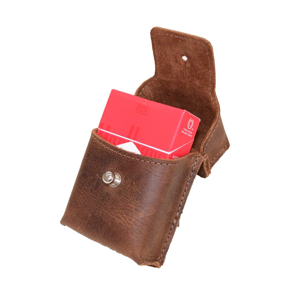 Hide & Drink's handmade Cigarette Pack Cover featuring a stylish design and red cigarette pack inside. This Full Grain Leather accessory is expertly hand-cut and hand-sewn, showcasing artisan craftsmanship, ideal for smokers seeking quality tobacco cases.