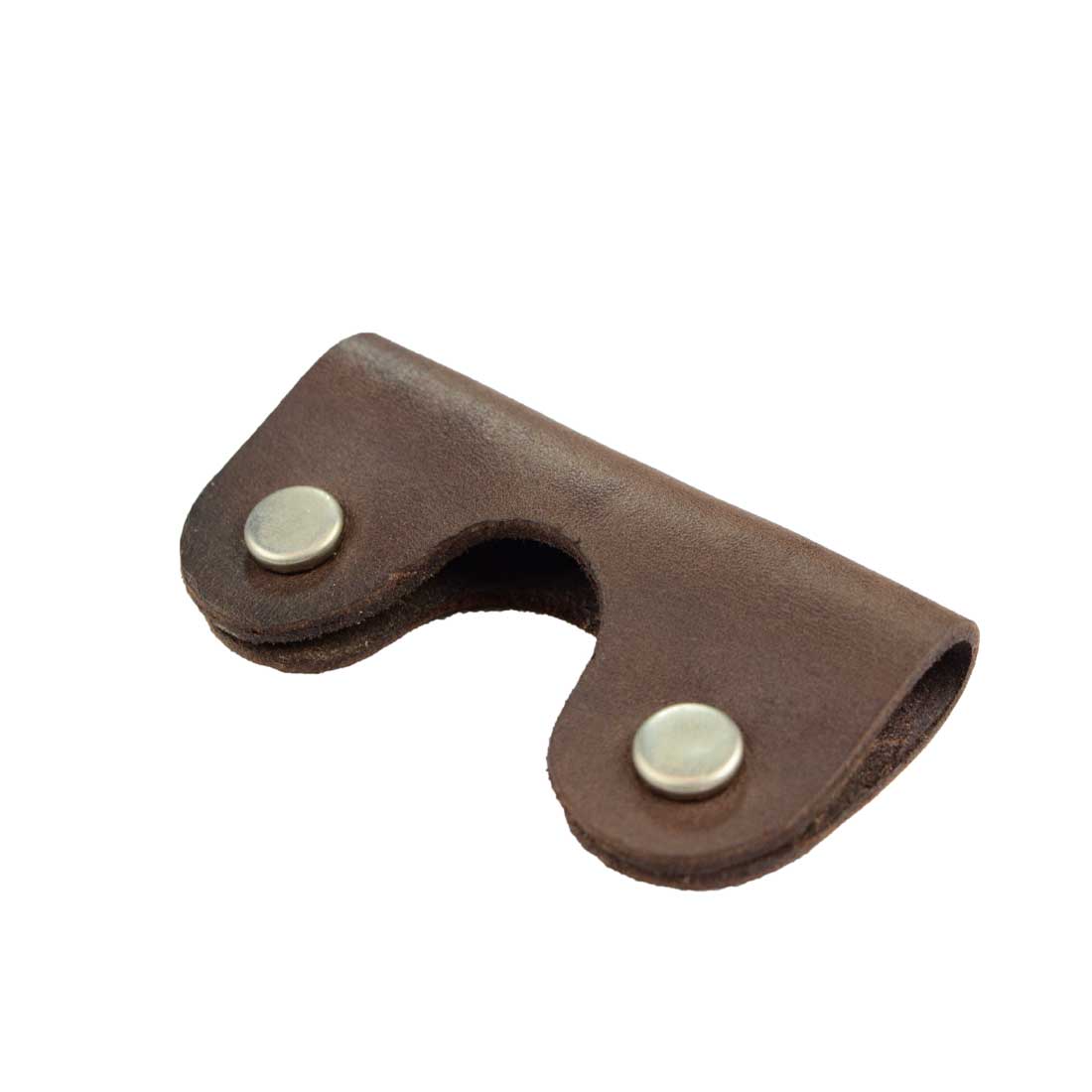 Close-up of the Wrap Cord Keeper by Hide & Drink, showcasing the durable full grain leather craftsmanship, perfect as a cable organizer holder or headset winder. Ideal accessories made with small batch production and handmade in La Antigua Guatemala & Oaxaca Mexico.