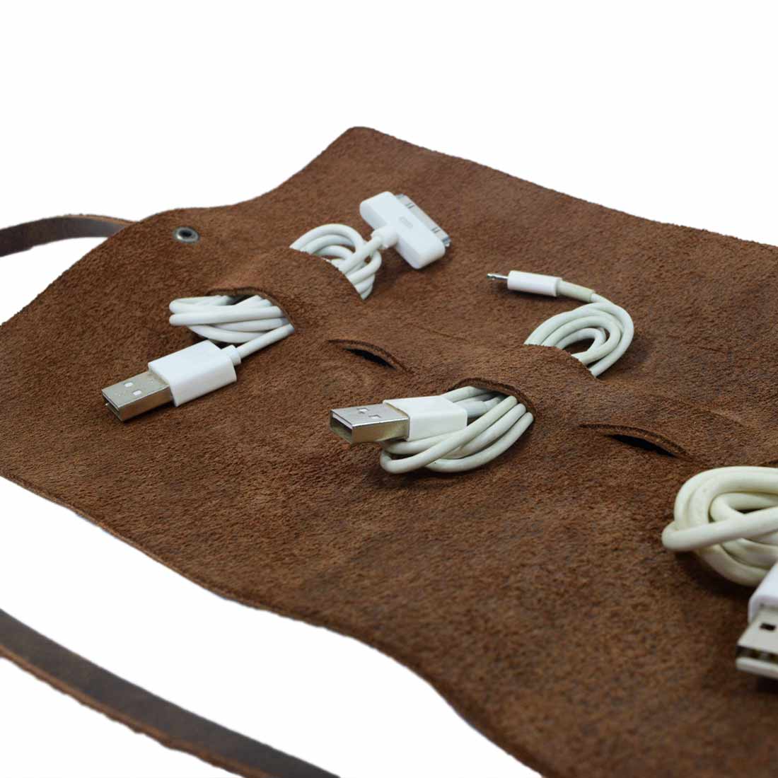 Close-up of Hide & Drink Cord Pouch highlighting its handmade features, ideal as a cord wrap or cable holder. This full grain leather travel bag is crafted by artisans in small batch production in La Antigua Guatemala & Oaxaca Mexico.