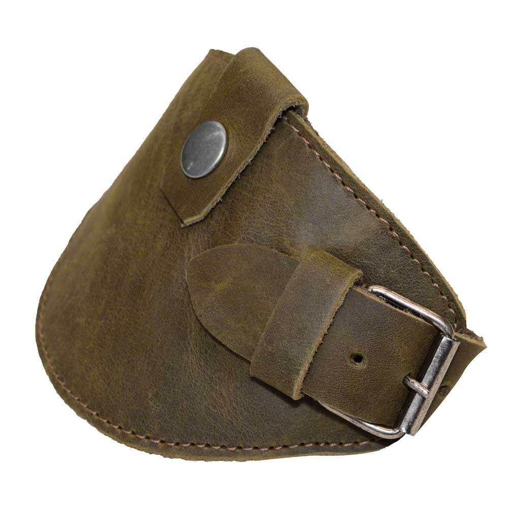 Motorcycle Boot Protector in olive green by Hide & Drink, featuring a buckle closure designed to protect your shoe from the shifter. This rustic shoe cover is handmade from full grain leather, showcasing artisan skill and quality from La Antigua Guatemala.
