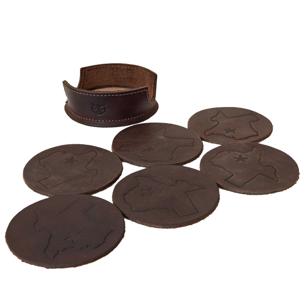 Showcasing the complete Texas State Coasters (6-Pack) by Hide & Drink, including the coaster holder and six coasters with a Texas map design. Made from Durable Thick Leather, these Lone Star Coasters Without Stitching celebrate artisan craftsmanship and are proudly handmade in La Antigua Guatemala & Oaxaca Mexico.