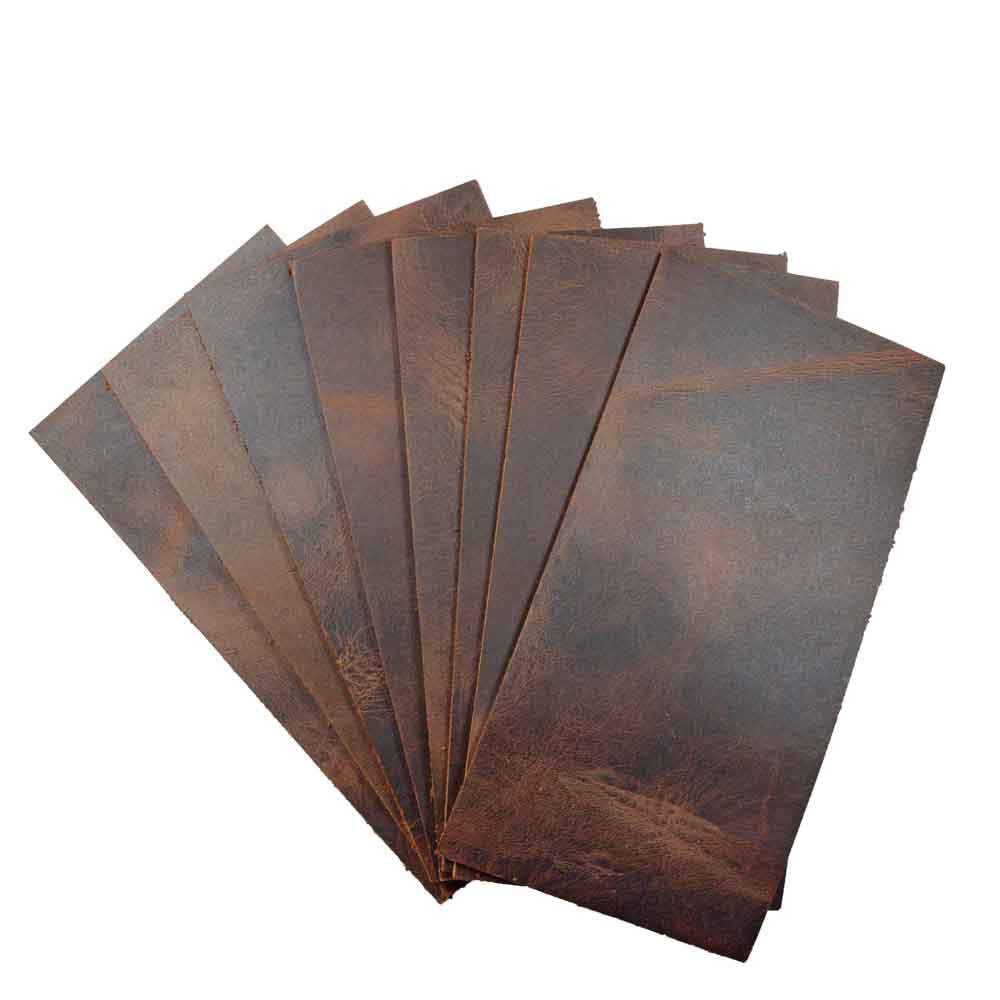 Leather Rectangular Scraps 3 x 6 in. (8 Pack) from Hide & Drink, showcasing thick full grain leather rectangles in a rich brown tone. Ideal for crafts, tooling, and hobby workshops. This 8 piece set features heavy-weight leather (3-3.5mm) and is hand cut, hand sewn, and fire branded, made by artisans in La Antigua Guatemala.