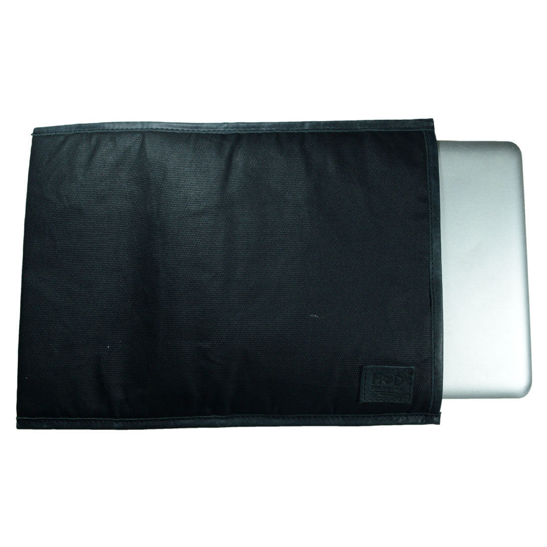 Laptop Sleeve 14 in. by Hide & Drink featuring a sleek design with a MacBook inside, perfect for protecting your device. This Sleeve Compatible with MacBook Air/Pro 13 Inch with M1 Chip is handmade from Waxed Canvas, showcasing small batch production, and is hand cut, hand sewn, and fire branded by artisans in La Antigua Guatemala & Oaxaca Mexico.