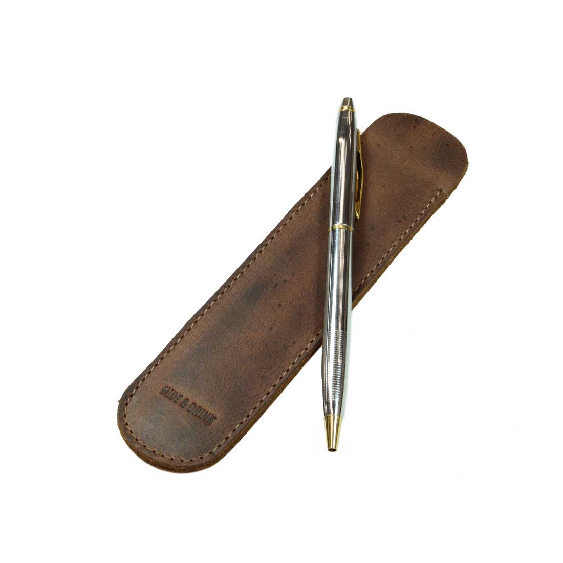 A sleek Vintage Pen Sleeve by Hide & Drink, showcasing the beautiful design crafted from Full Grain Leather, perfect for office essentials and bookworm accessories. This artisan product is handmade in La Antigua Guatemala & Oaxaca Mexico, featuring small batch production and fine craftsmanship.