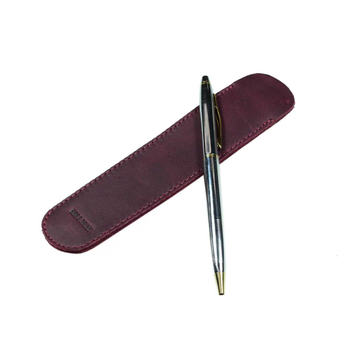 A close-up of the Vintage Pen Sleeve in burgundy by Hide & Drink, showcasing its vibrant color and artisan craftsmanship. Ideal for office essentials and crafted with care from Full Grain Leather.