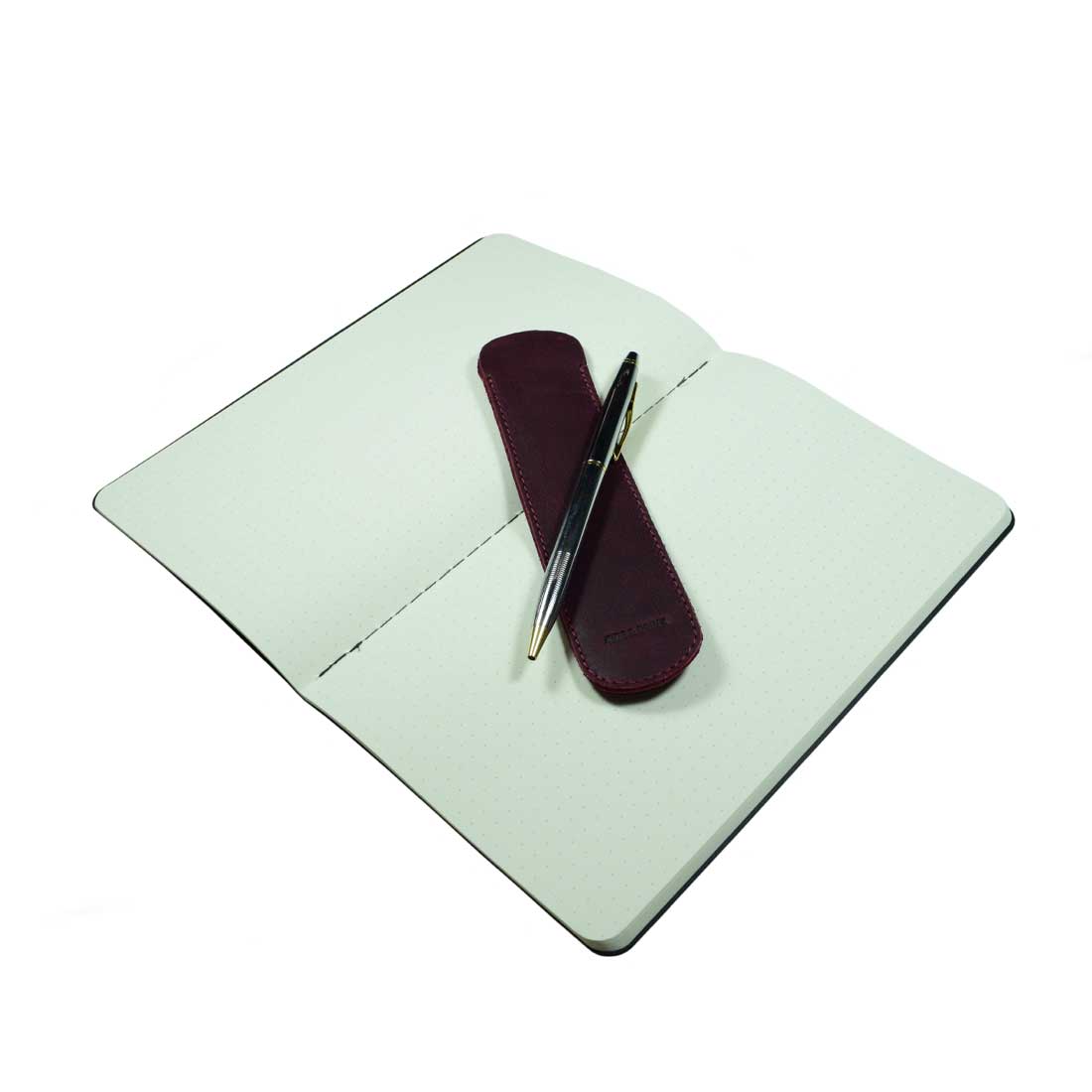A close view of the Vintage Pen Sleeve in burgundy from Hide & Drink, highlighting the texture and quality of Full Grain Leather. A chic accessory for pen lovers and book enthusiasts.