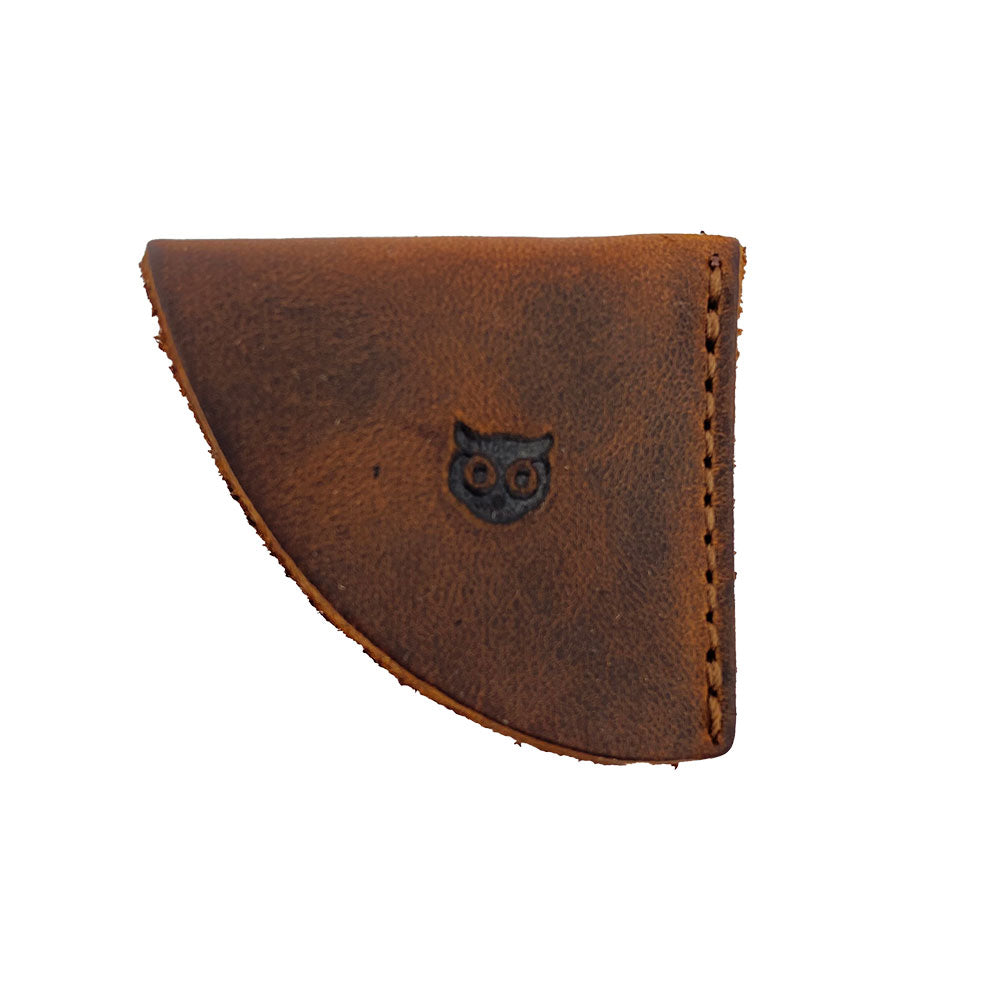 Stylish leather corner bookmark from Hide & Drink, part of the Corner Bookmark 3-Pack, showcasing a vintage owl design. This bookmark exemplifies small batch production and is made of full grain leather, making it a perfect book accessory for every reader. Each piece is hand cut, hand sewn, and fire branded, representing artisan craftsmanship from La Antigua Guatemala & Oaxaca Mexico.
