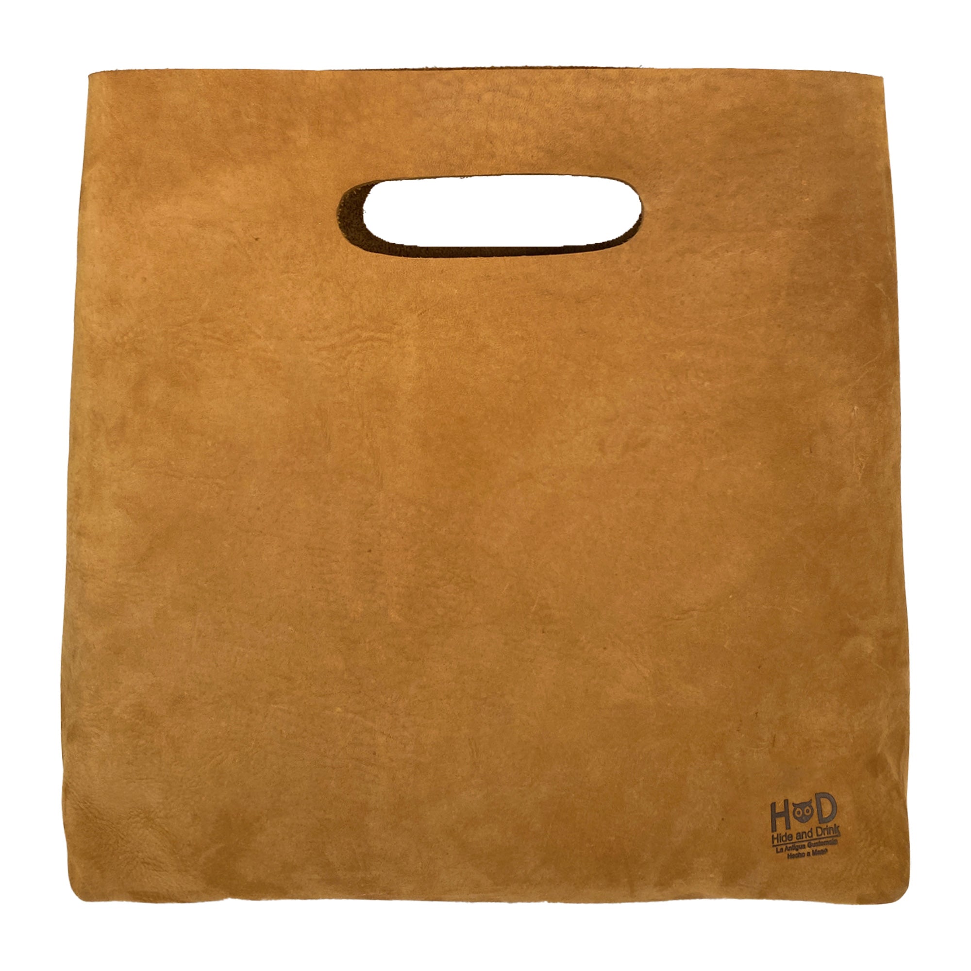 Front view of the Minimalist Boho Handbag by Hide & Drink, showcasing a rustic, handcrafted design. This Minimalist Handbag for Women, made of high-quality Full Grain Leather, serves as a stylish Tote Bag, perfect for shopping. Crafted artisanally in La Antigua Guatemala and Oaxaca Mexico, it features small batch production, hand cutting and sewing, with a fire branded logo reflecting its quality.