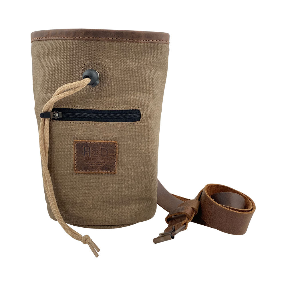 Hide & Drink Chalk Bag made of Waxed Canvas, featuring a zippered pocket, ideal for rock climbing or gymnastics. Crafted from Full Grain Leather, this artisan bag is hand cut and hand sewn, showcasing small batch production techniques from La Antigua Guatemala & Oaxaca Mexico.