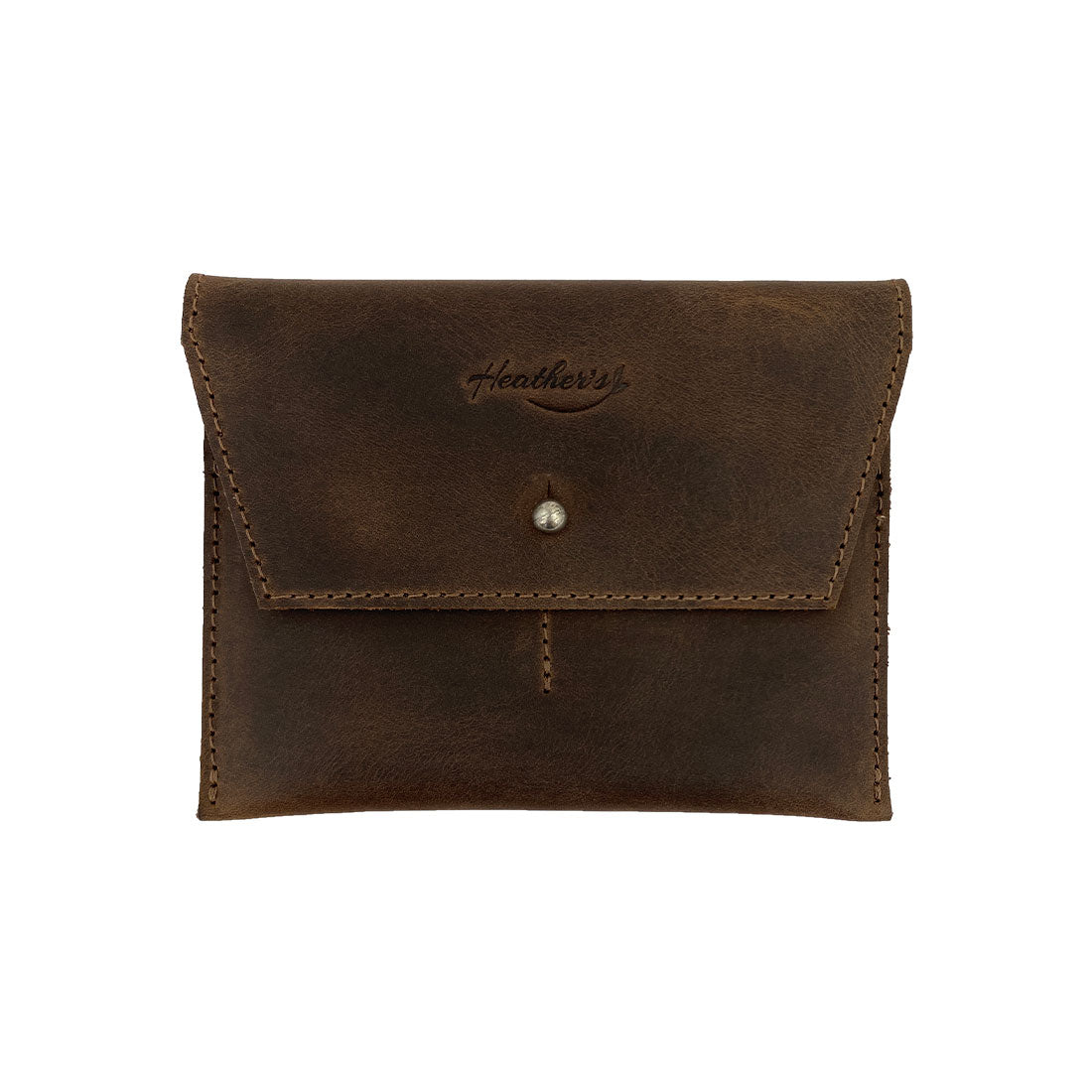 Heather's Minimalist Wallet in dark brown, a durable cash organizer and card holder made from full grain leather. This versatile accessory is perfect for everyday use and travel, showcasing small batch production and artisan craftsmanship. Handmade in La Antigua Guatemala & Oaxaca Mexico.