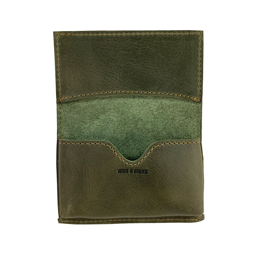 Back view of Hide & Drink's Vintage Card Holder in olive green leather, highlighting its durable craftsmanship. This versatile wallet serves as a cash organizer and business card holder, handcrafted by artisans in La Antigua Guatemala & Oaxaca Mexico.