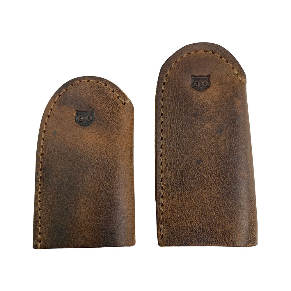 Leather Thimble for Thumb & Index Finger (3 Paires) by Hide & Drink featuring a close-up view of a set of 3 pairs (6 pieces) of thimbles. This finger protector is ideal for sewing, hand appliqué, EPP, and quilting, showcasing high-quality full grain leather. StockyardX presents these artisan, handmade thimbles, hand cut and hand sewn, with fire branded detailing, crafted in La Antigua Guatemala & Oaxaca Mexico.