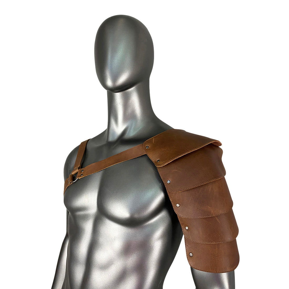 Featuring the Hide & Play Single Shoulder Cover, this image captures the craftsmanship of this costume arm shield in premium full grain leather. Designed for cosplay events and medieval attire, it includes adjustable straps for comfort and style. Each piece is handmade in La Antigua Guatemala, emphasizing artisan quality and small batch production.