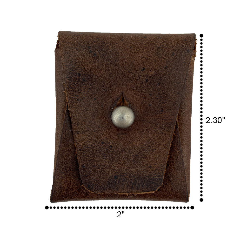 Dimensions of the Minimalist Square Coin Pouch by Hide & Drink illustrated on a measuring tape. Crafted from full grain leather, this pouch reflects the quality and attention to detail from artisan craftsmanship. Minimalist Coin Pouch, SD Card Holder, Wallet and Cash Organizer, Full Grain Leather, StockyardX, Small Batch Production, Hand Cut, Hand Sewn, Fire Branded, Artisan, Handmade in La Antigua Guatemala & Oaxaca Mexico.