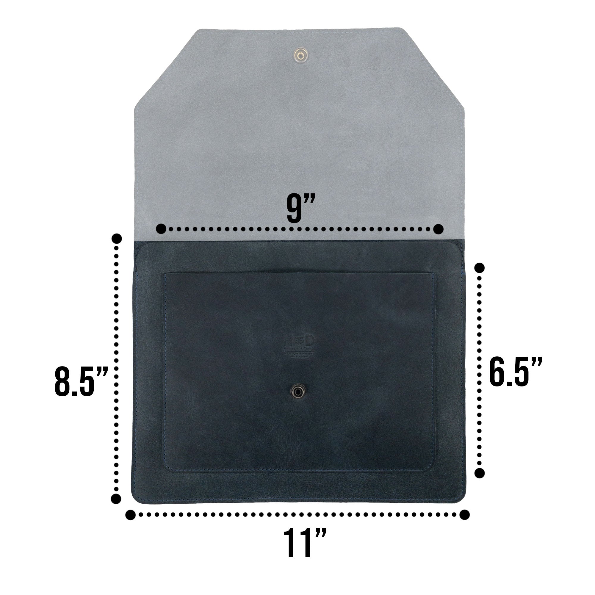 Hide & Drink's Slim Portfolio displayed alongside smaller items, emphasizing its utility as a handmade Flat Messenger Case. This Full Grain Leather Narrow Document Holder is perfect for office use, handcrafted in La Antigua Guatemala & Oaxaca Mexico.