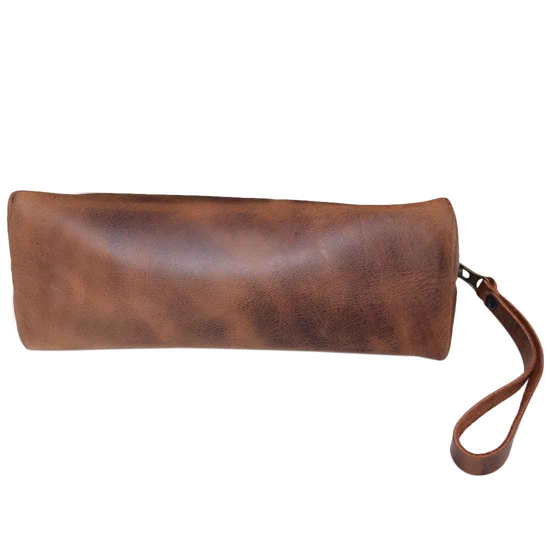 The Accessory Pouch Organizer Hand Bag from Hide & Drink showcases a sleek design in full grain leather. Ideal as a Cosmetic Travel Organizer with Hand Strap for Women, it serves perfectly as a Makeup Bag or Classic Handbag. Each piece is hand cut and sewn, reflecting small batch production craftsmanship in La Antigua Guatemala & Oaxaca Mexico.