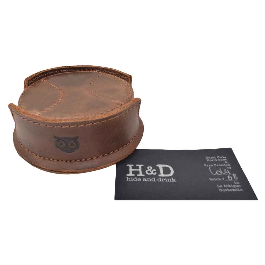 An overhead view of the Hide & Drink All Baseball Coaster (8-Pack) showcasing the coaster holder alongside the coasters, made from durable Waxed Canvas & Full Grain Leather. This artisan product is designed for stain protection in home, bar, and kitchen settings, handcrafted in La Antigua Guatemala & Oaxaca Mexico.