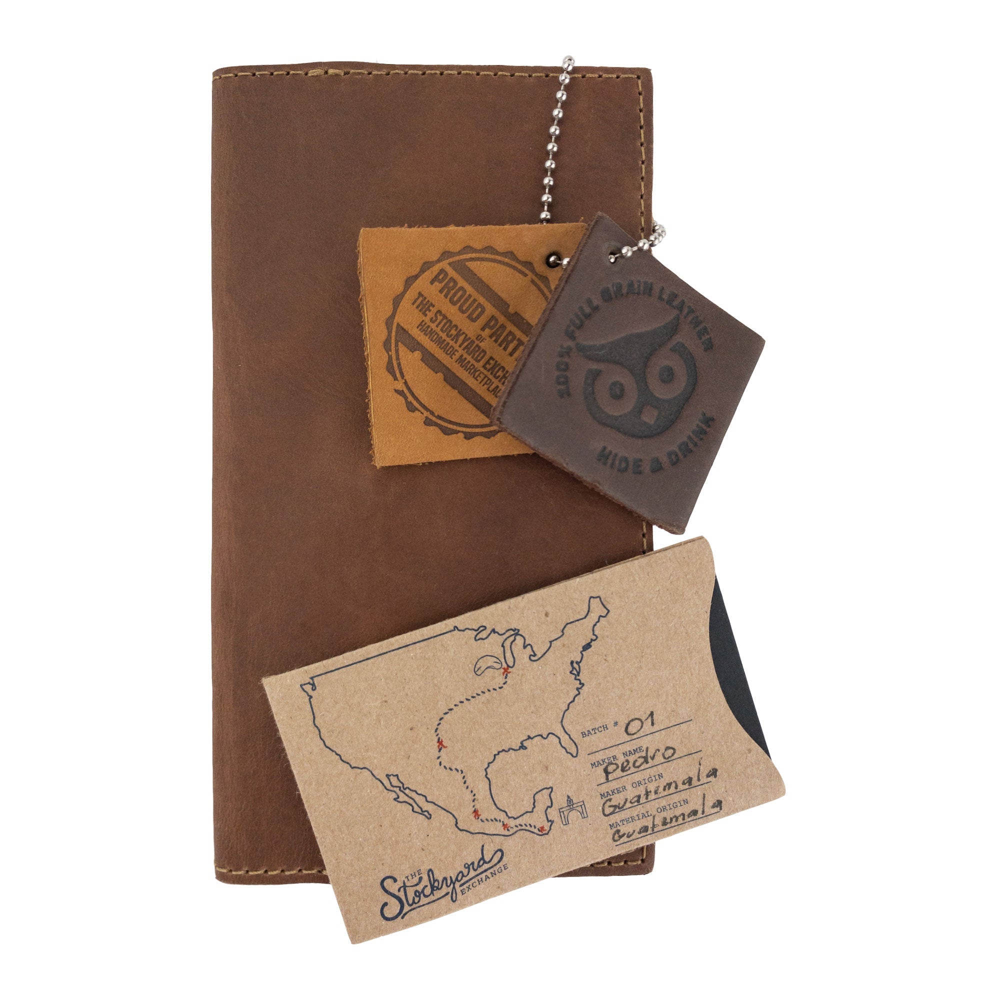 Inside view of the brown Checkbook Leather Cover by Hide & Drink, ideal for keeping standard checkbooks organized in a minimalist fashion. This piece is handmade from full grain leather by artisans in La Antigua Guatemala and Oaxaca Mexico, highlighting small batch production.