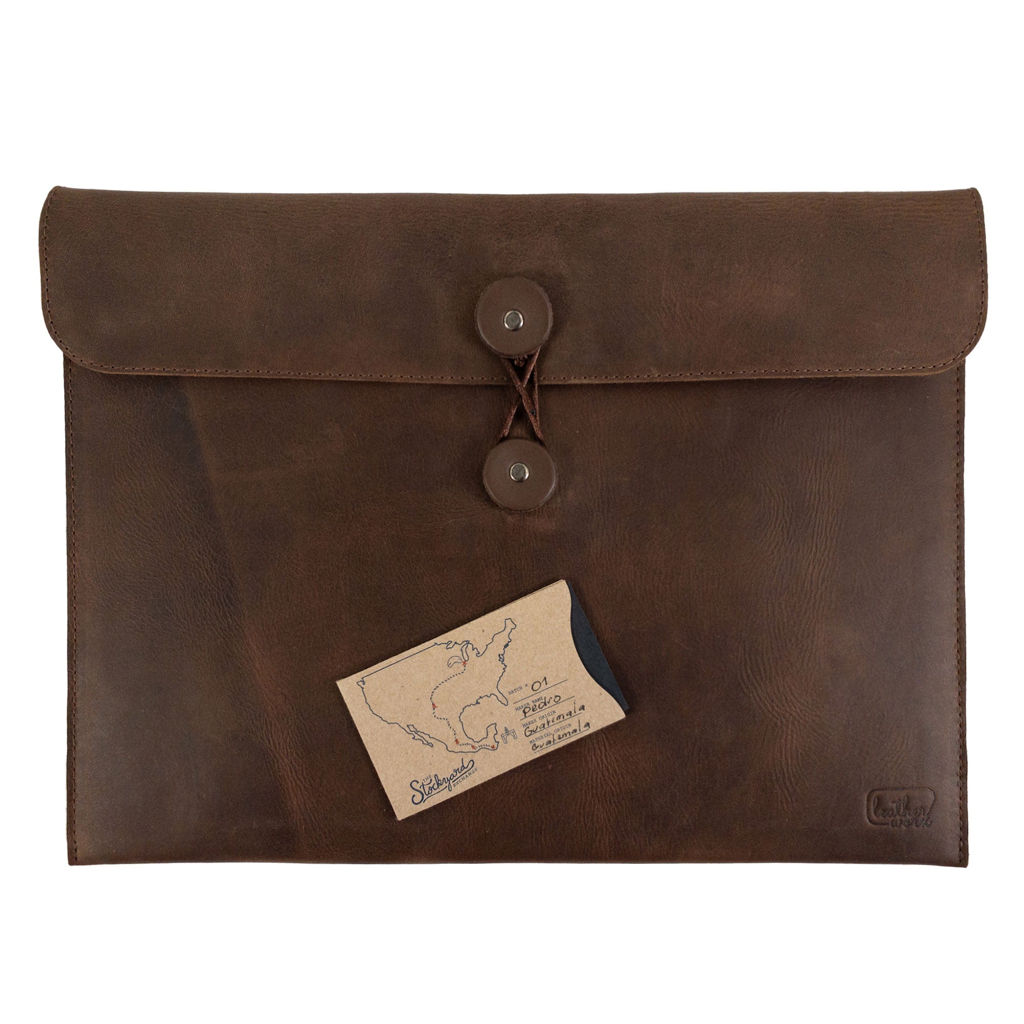 Horizontal Mailing Envelope by Leather Worx alongside a business card, reflecting its elegant design in Full Grain Leather; this artisan product highlights hand cut and hand sewn craftsmanship, proudly made in La Antigua Guatemala & Oaxaca Mexico.