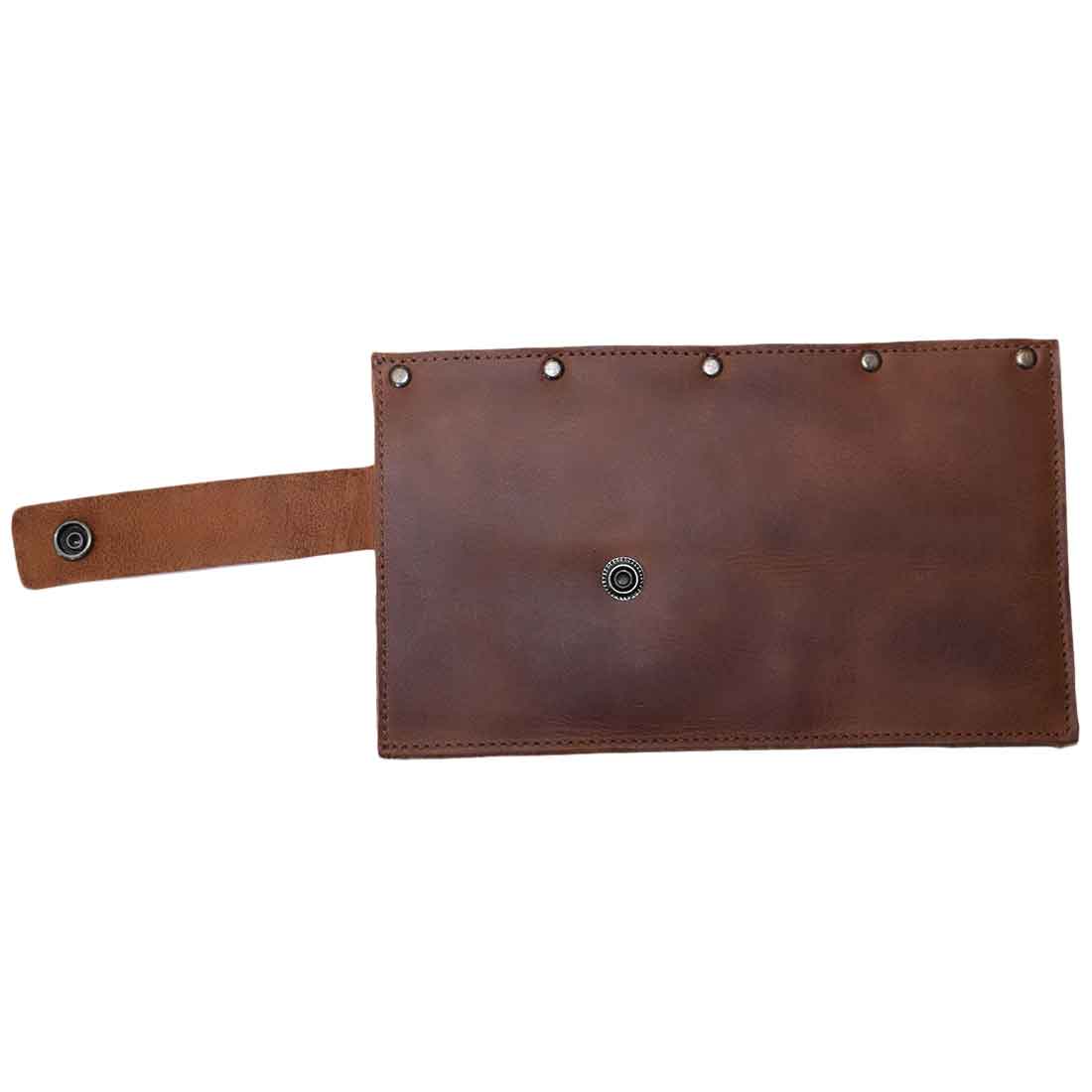 Hide & Drink Butcher Knife Holster with a sleek design, shown upside down, exemplifying the superior quality of the full grain leather. This butcher knife holster not only serves as a stylish blade cover but also showcases the handcrafted artistry that defines kitchen essentials for every culinary enthusiast in La Antigua Guatemala & Oaxaca Mexico.