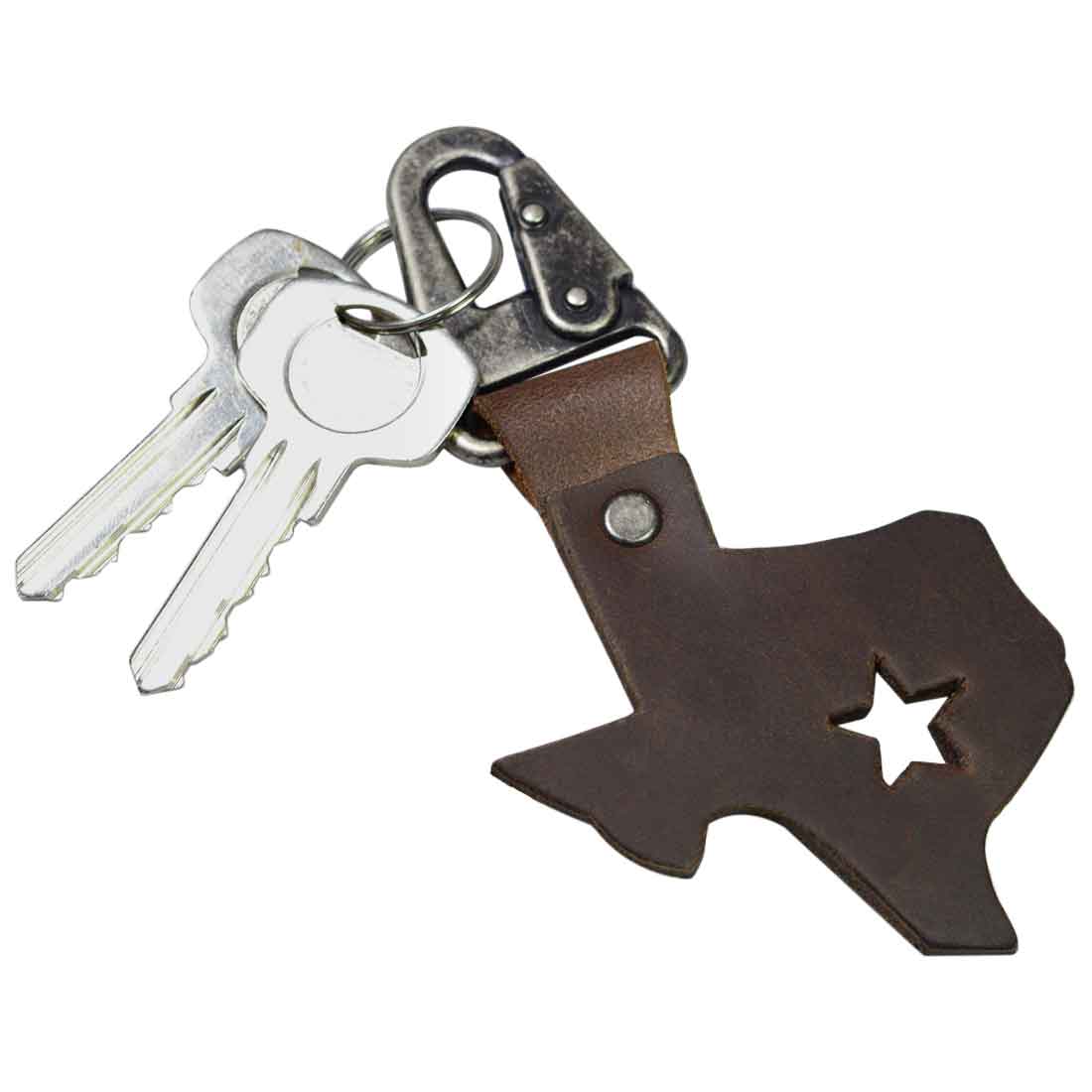 Texas Keychain Holder by Hide & Drink featuring a Texas state silhouette made from thick full grain leather, showcasing a star cutout. Ideal Texas souvenir, this handmade key chain holder embodies artisan craftsmanship with small batch production methods. Perfect for Texas lovers.