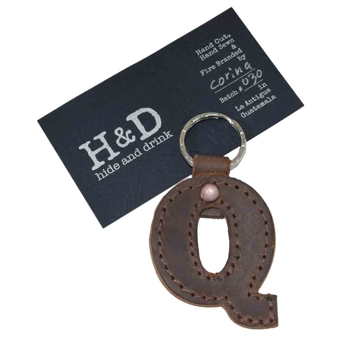 Letter Q in a stylish thick leather keychain by Hide & Drink. This Alphabet Letter Keychain, made from Full Grain Leather, highlights artisan craftsmanship that comes from small batch production in La Antigua Guatemala.