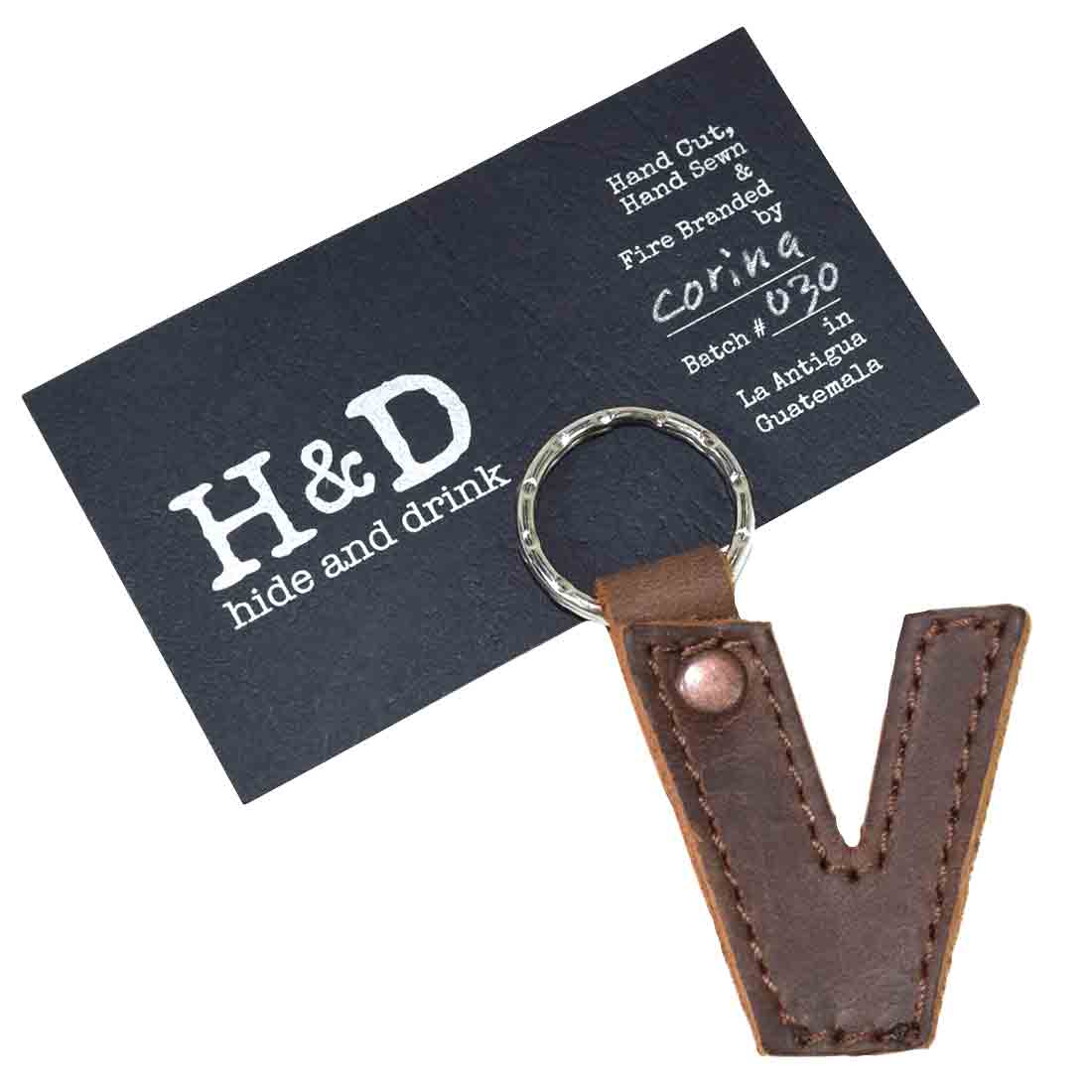 Letter V keychain by Hide & Drink. This stylish Alphabet Letter Keychain, crafted from thick Full Grain Leather, reflects the artisan techniques used in small batch production from La Antigua Guatemala.