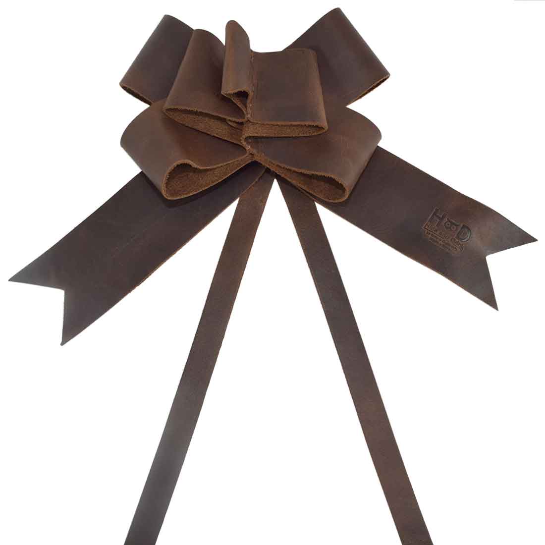 Elegant Bourbon Brown Ribbon Decor by Hide & Drink featuring a handcrafted Bow Wrap for Christmas made from Full Grain Leather. Perfect for adding a rustic touch to your holiday gifts, showcasing artisan quality with small batch production, hand cut and hand sewn detail fire branded in La Antigua Guatemala and Oaxaca Mexico.