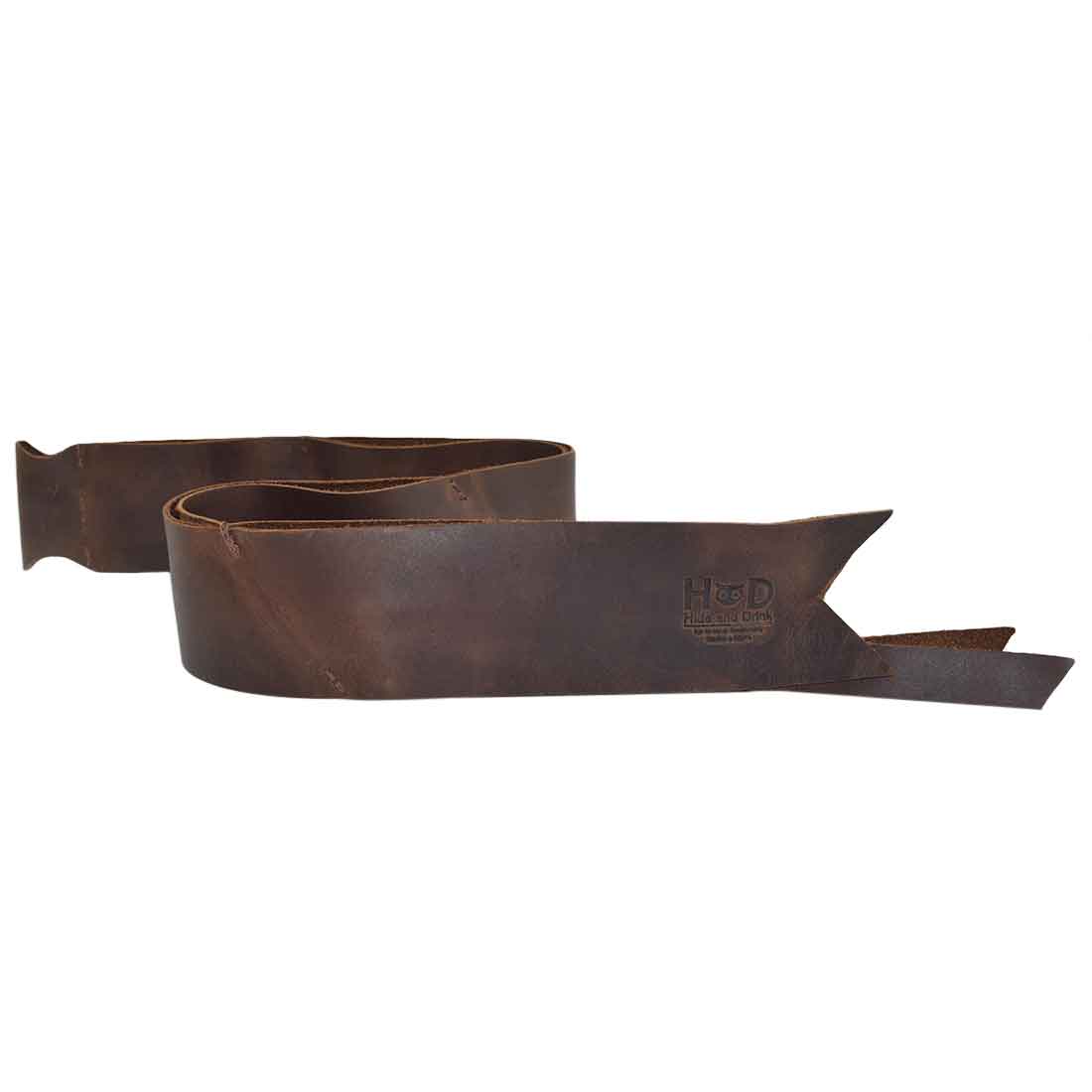 Stylish Bourbon Brown Ribbon Decor Bow Wrap for Christmas by Hide & Drink, crafted from durable Full Grain Leather. This unique piece is perfect for personalizing gifts, emphasizing small batch production, hand cut, and hand sewn artisan craftsmanship made in La Antigua Guatemala and Oaxaca Mexico.