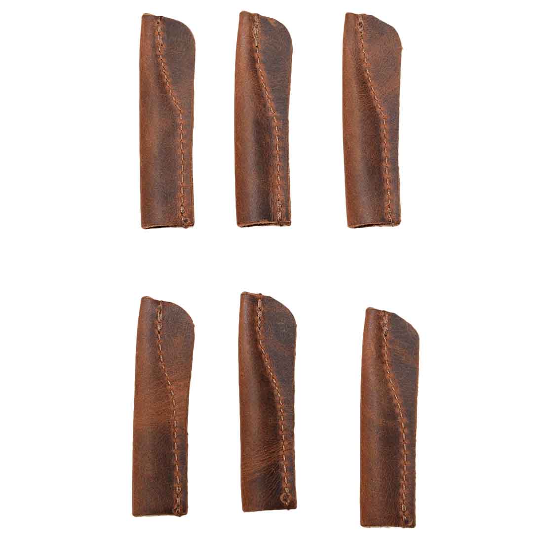 Close-up of the Hide & Drink Pencil Cap (6 Pack) leather caps showcasing the crafted details and stitching. This set of 6 pencil caps makes classy covers for office essentials, handcrafted from top-quality full grain leather in small batch production.