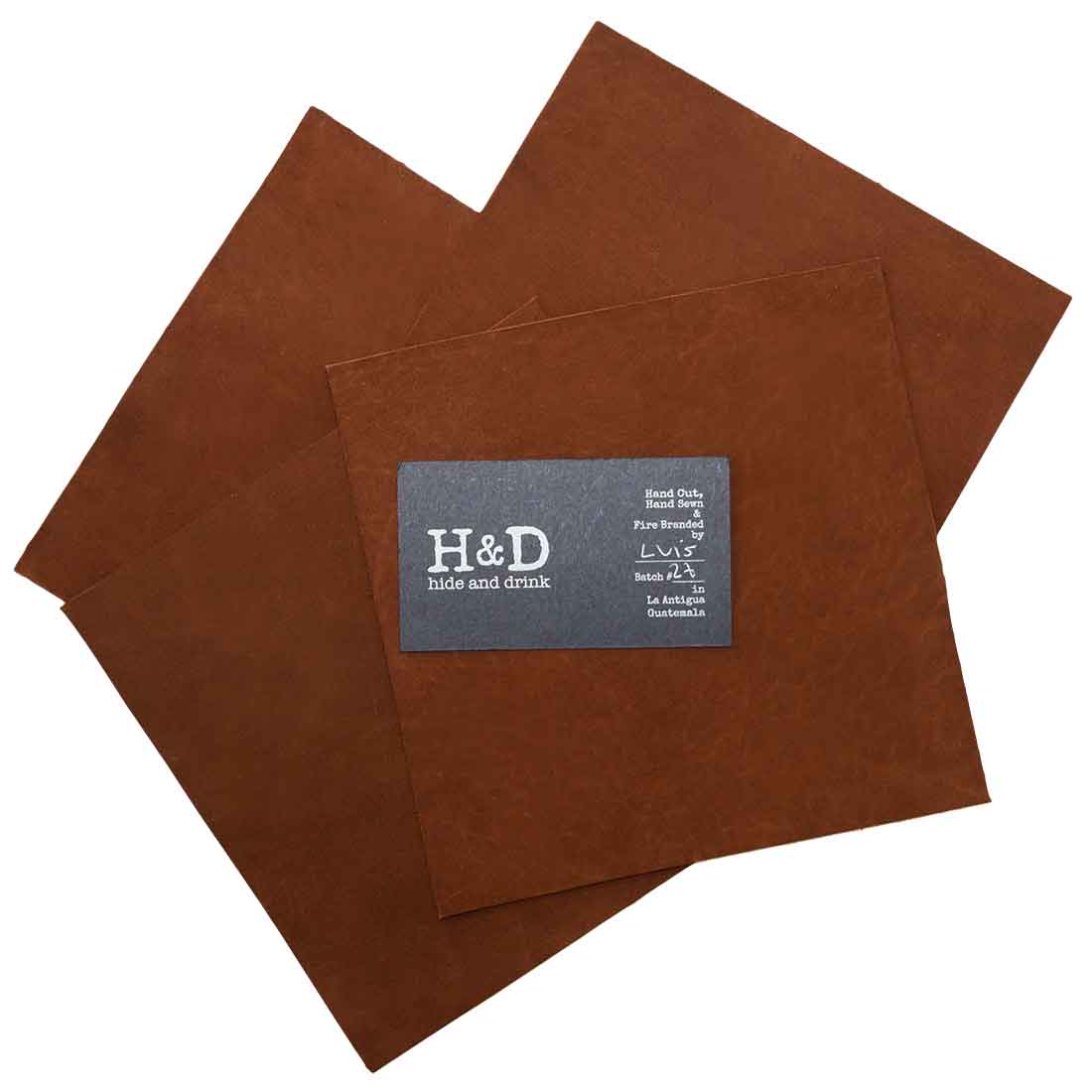 Hide & Drink Leather Squared Scraps 6 x 6 in. (4 Pack) showcasing a rich light brown leather rectangle, perfect for crafting and tooling. Each piece is handcrafted and made of 1.8mm thick full grain leather by skilled artisans in La Antigua Guatemala and Oaxaca Mexico.