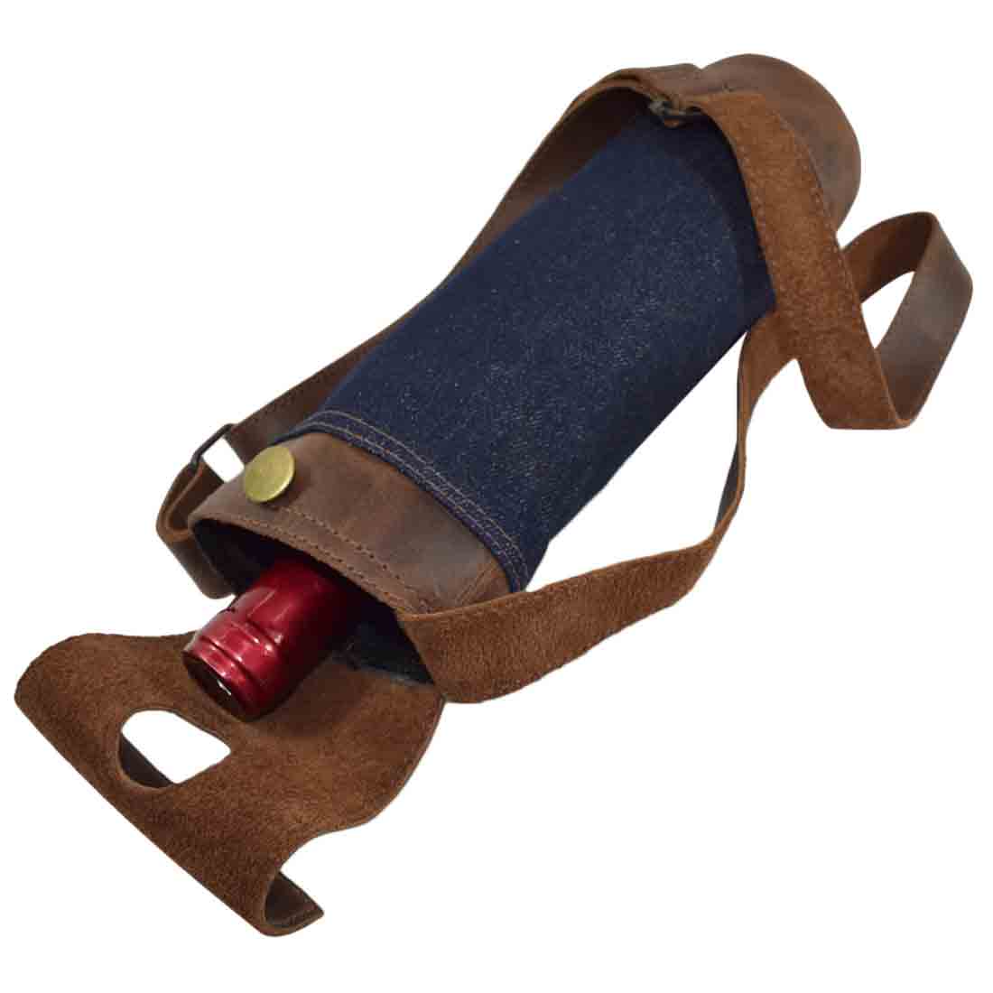 Hide & Drink Wine Caddy featuring a stylish design with repurposed denim and full grain leather. This artisanal wine carrier tote combines hand cut, hand sewn, and fire branded techniques, showcasing small batch production by artisan craftsmen in La Antigua Guatemala and Oaxaca Mexico.